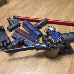 Dyson V6 cordless vacuum cleaner with attachments Works fine just ineed of a new battery