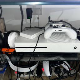 Xbox One S 2TB day one edition, in very good condition. Selling with 2 white controllers, an official seagate 4TB external hard drive, turtle beach recon 200 headset, turtle beach elite pro tactical audio adaptor. I have around 40 games on my account which if possible will transfer to you.