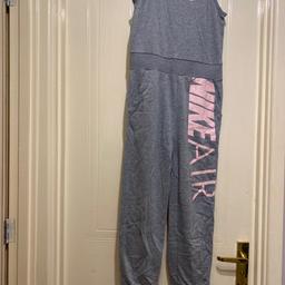 Girls grey genuine nike air all in one jumpsuit with pockets and a pink nike logo in excellent condition collection from ws2 beechdale area
