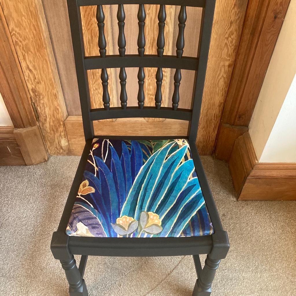 This beautiful chair is made of solid wood with a turned spindle back and sturdy carved legs. It has been sanded and finished in Frenchic Blackjack and the seat has been recovered in a botanical patterned velveteen fabric to give it that luxe feel. It would make a lovely addition to any room. Overall height 93cm, height to seat 46cm, width 46cm and depth 47cm approx. Collection from Dunsville, Doncaster.