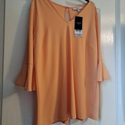 next size 14 top looks great with a pair of jeans or trousers photo doesn't do it justice 