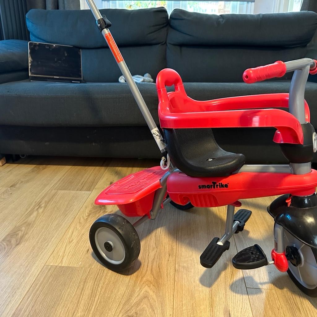 SmarTrike - used but in a very good condition. Some wear and tear to the wheels.