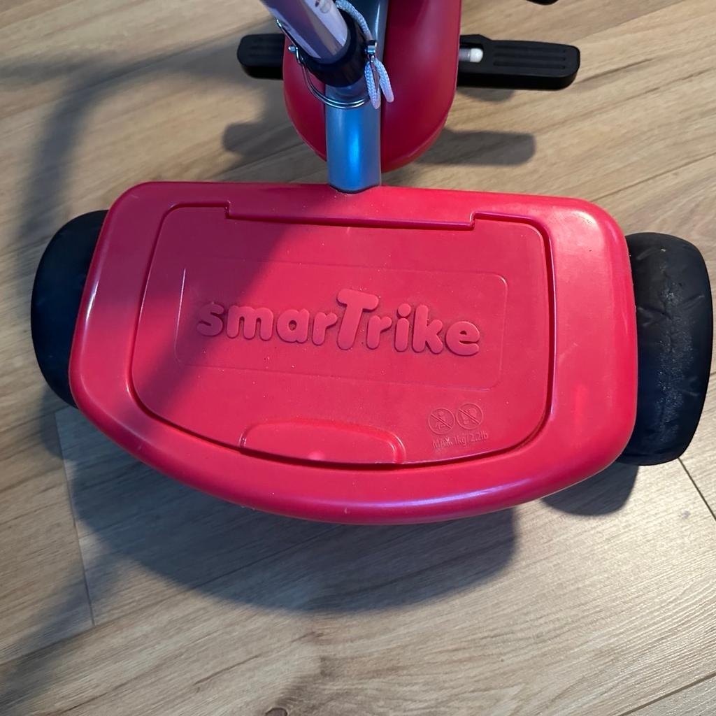 SmarTrike - used but in a very good condition. Some wear and tear to the wheels.