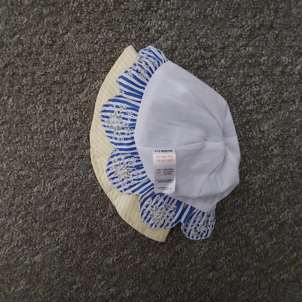 Hat Panama “Matalan”

Little Kids Part of 2 Piece Set

Blue Yellow Mix Colour

New With Tags

Actual size: cm

Height: 15 cm

Head volume: 48 cm – 49 cm

Depth: 16 cm

Age: 6 - 12 Months

Composition Yellow Hat:

Shell Body: 100 % Cotton

Shell Brim: 52 % Cotton
 47 % Polyester
 1 % Viscose

Lining: 92 % Polyester
 8 % Cotton

Exclusive of Trimmings

Composition Blue Hat:

Shell: 100 % Cotton

Lining: 91 % Polyester
 9 % Cotton

Exclusive of Trimmings

Made in China