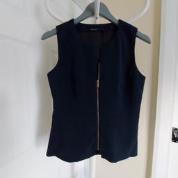 Top Blouse"Karen Millen"

Zip Front Shell Top

 Navy Colour

 New With Tags

Actual size: cm and m

Length: 55 cm front

Length: 59 cm back

Length: 37 cm from armpit side

Shoulder width: 34 cm

Volume hands: 39 cm

Volume chest: 88 cm - 90 cm

Volume waist: 80 cm – 81 cm

Volume hips: 87 cm – 88 cm

Length: 37 cm before to waist

Length: 14 cm from armpit side before to waist

Belt width: 4 cm

Size: 12 (UK) Eur 40,US 8

Main: 65 % Triacetate
 35 % Polyester

Lining: 100 % Polyester

Made in Turkey