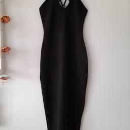 Boohoo Black Dress - worn once
Size 8 - quite stretchy material
Cross over back straps , small up slit on the back
Smoke and pet free home