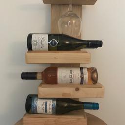 Handmade wine rack holds 6 bottles