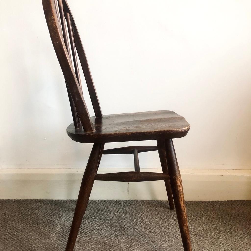 A single 1960s Ercol stick back Windsor chair in dark wood finish.

First designed by Ercol founder Lucian Ercolani in the 1950s, this simple mid-century chair encapsulates the elegant style and craft that has made the brand a British furniture institution. Lovingly made by hand, each Windsor Chair was made using the highest quality hardwoods within Ercol’s British workshops.

In good functional vintage condition but marks and wear that you would expect with age.

H: 81cm W: 42cm D: 41cm
(approximate measurements)

For collection from E2, London.