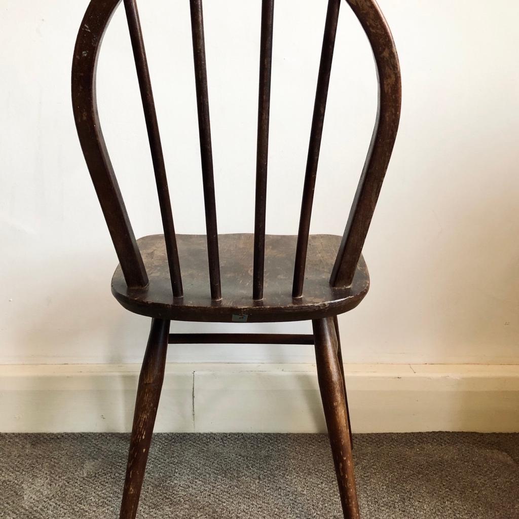 A single 1960s Ercol stick back Windsor chair in dark wood finish.

First designed by Ercol founder Lucian Ercolani in the 1950s, this simple mid-century chair encapsulates the elegant style and craft that has made the brand a British furniture institution. Lovingly made by hand, each Windsor Chair was made using the highest quality hardwoods within Ercol’s British workshops.

In good functional vintage condition but marks and wear that you would expect with age.

H: 81cm W: 42cm D: 41cm
(approximate measurements)

For collection from E2, London.