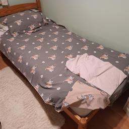 Double sided. Grey and pink/peach.with fitted sheet.