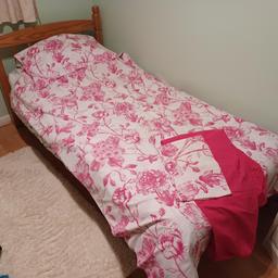 Pink flowery single duvet, pillowcase and fitted sheet.