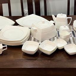 Complete dinner set 53 piece
Make: SHINEPUKUR
Material: BONE CHINA
Colour: cream/off white

- 6 teacups
- 6 saucers
- 6 small dessert bowls
- Sugar pot
- Teapot
- Milk jug
- Gravy boat
- 6 side plates
- 6 dinner plates
- 6 bowls
- 3 large serving bowls
- 6 pasta/Soup plates
- 2 serving platter
- Meat platter
- casserole/soup server (kurma dhani)

NEVER USED, UNWANTED GIFT.

Collection only! 5mins from Gants Hill Station.
open to offers