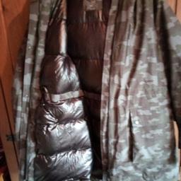Worn once doesn't suit me ,cost £110 .Very warm feather and down ,inside quilted Lining,machine washable.fur around the hood.Stormwear made for outdoors.Camouflage pattern