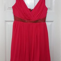 looks red on this photo (bad lighting!) but it's actually fuschia/pink. beautiful 
only worn twice