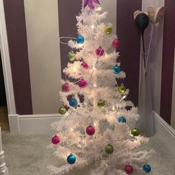 Two Christmas trees with  lights and decorations which can be folded away and put in a bag. There is two available, will sell separately or both together. From a clean and smoke, free home, both for £15 or will sell separately for. £10.
