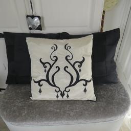 set of 3 beautiful cushions only bin on bed