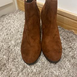 These tan/ copper coloured suede type boots have a nice size heels very comfortable and are a size 6 collection or can post