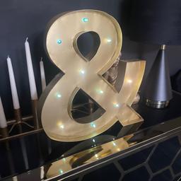 Large gold ampersand (&)
Used for display last Christmas 
Can be wall mounted or freestanding 
In good working order
Collection only 
Smoke and pet free home 
No offers thanks