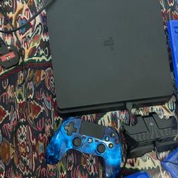 Very very good condition with 2 controllers and the controllers are not guinean . The charger is from Ps4 company and it is guinean you can charge 2 controllers in a same time with 7 games included with jt .