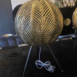 Black tripod gold leaf pattern metal ball lamps large
Brand new bought from homesense no longer needed 
Have two for sale price is for each 
I paid £69.99 each for them 
Open to sensible offers if having both
Have tried both to show working 
Collection only 
Smoke and pet free home