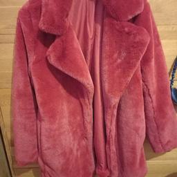 has new ( labels removed) stunning deep red soft fur coat.Hnm size small.Id say a size 12/ 14 I'm a 14 and it fasteners.2 concealed press stud closers.
