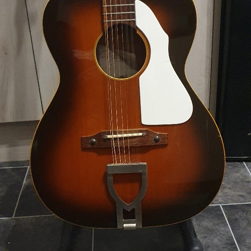 I've had this parlour sized vintage guitar around 30 years. I bought it with the little dent on the back, and intended to have it repaired, but it didn't make any difference to the guitar so left as is.

It has a few lacquer cracks on the top due to the age of it, but just adds to the mojo. It's completely original, tuners are a little stiff but completely usable and still hold the tuning very well.

The back is an arch style that helps
project the sound, and internally it is ladder braced.