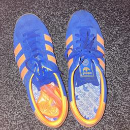 Men’s blue and orange adidas trainers 
Worn a couple of times
No silly offers please!