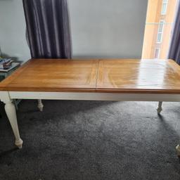 Nice off white and oak dining table. very strong can be extended also. seats 6-8 people. open to offer