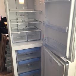 Indesit silver fridge/ freezer frost free in very good condition and excellent working order no damage spotlessly clean inside and out can be seen working as been turned on for a couple of days so you can see it working frost free / automatic defrost reversible door model no BAN 12 NF size 5ft-9ins Height/ 23 and half ins Width across/ 25 and half ins Depth front to back / fridge has internal light /3 safety glass shelves/ 2 salad boxs/ 3 departments on door / hygiene control / has automatic defrost / freezer has 3 pull out drawers / ice trays on top of freezer drawers / genuine reason for selling it belonged to my daughter now buying a smaller one welcomed to view collection only please