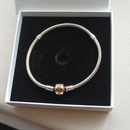 genuine pandora silver bracelet
with rose gold clasp 19cm.
as new condition