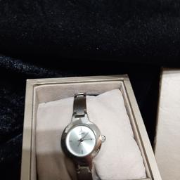 Next boxed ladies watch good condition battery required as been In box while. Collection or delivery please look at my other listings huge clearance great bargains to be had.