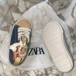 Brand New Unisex Cotton Shoes w/ zip detail. 
From Zara 

Even comes in the original bag, never been worn only tried on. 

Size 24 (infant size 7) 

£20

Can deliver to surrounding areas of B33 for £1 per mile, otherwise collection only.

Please see other items listed, thank you :)