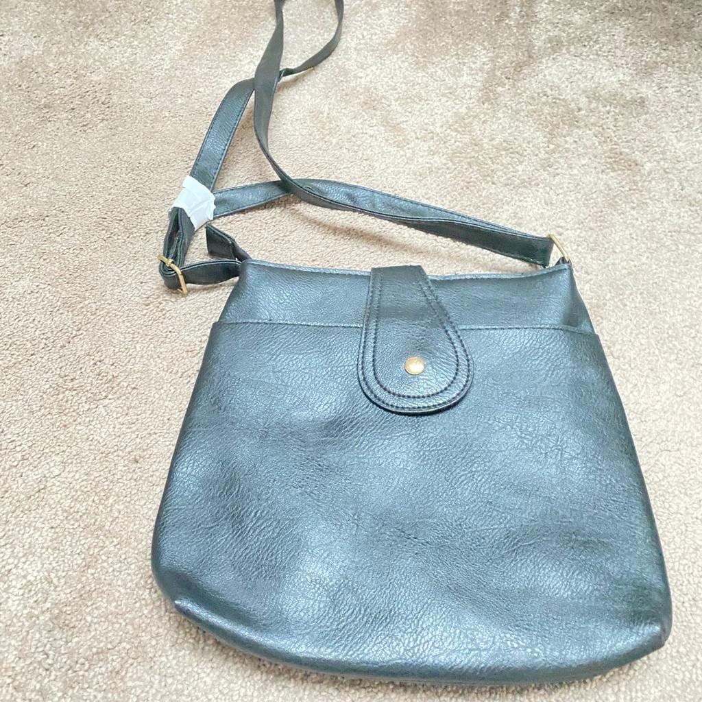 Good quality lined shoulder or cross-body bag with external and internal pocket and shoulder strap. Lightweight and good for travelling. Brand new with tag.