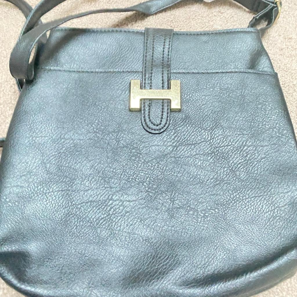 Good quality lined shoulder or cross-body bag with external and internal pocket and shoulder strap. Lightweight and good for travelling. Brand new with tag.
