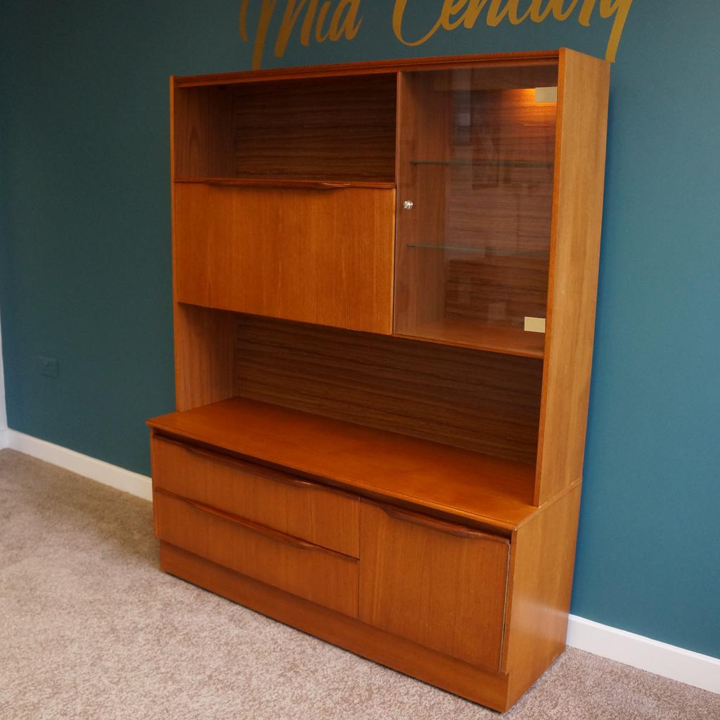 Mid Century Sowerby Bridge

Mcintosh Teak Sideboard/Display Cabinet

2 Large Drawers & Cupboard
Glass Door Cabinet With 2 Glass Shelves & Light
Drop Down Cabinet With Glass Shelf & Single Glass Shelf Above
Measurements H170cm x L136cm x D43cm

Unit Comes In 2 Parts
Top H115cm x L136cm x D30cm
Bottom H56cm x L136cm x D43cm On Castors

Collection from Mid Century Town Hall Street Sowerby Bridge, We are happy to liaise with couriers and would recommend Anyvan Or Shiply for quotations.

Please message me to arrange viewings
and check out my other items available

Items may show signs of wear and imperfections due to age