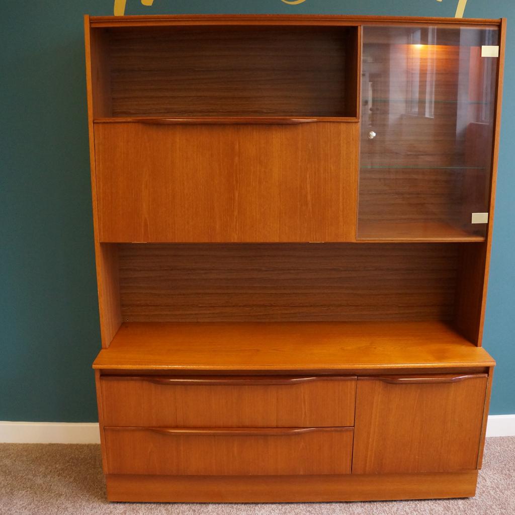 Mid Century Sowerby Bridge

Mcintosh Teak Sideboard/Display Cabinet

2 Large Drawers & Cupboard
Glass Door Cabinet With 2 Glass Shelves & Light
Drop Down Cabinet With Glass Shelf & Single Glass Shelf Above
Measurements H170cm x L136cm x D43cm

Unit Comes In 2 Parts
Top H115cm x L136cm x D30cm
Bottom H56cm x L136cm x D43cm On Castors

Collection from Mid Century Town Hall Street Sowerby Bridge, We are happy to liaise with couriers and would recommend Anyvan Or Shiply for quotations.

Please message me to arrange viewings
and check out my other items available

Items may show signs of wear and imperfections due to age