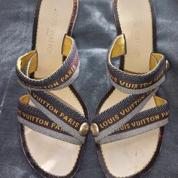 Louis Vuitton high heel mules. Louis Vuitton logo on straps and gold studs. 2.5 ins heels 👠.  Unfortunately no box.