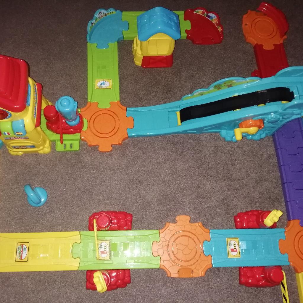 Two sets of toot toot and 4 vehicles, in excellent condition and washed, the black belt in train station is broken but can be replaced for a few pounds, rest is perfect, train station and garage... Collection only