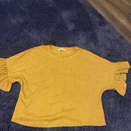 Ladies oversized t shirt style top
Dark mustard colour
Big frill to sleeve edges