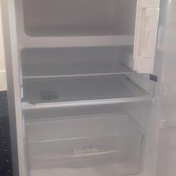 New small fridge with small freezer inside only two mark on front door