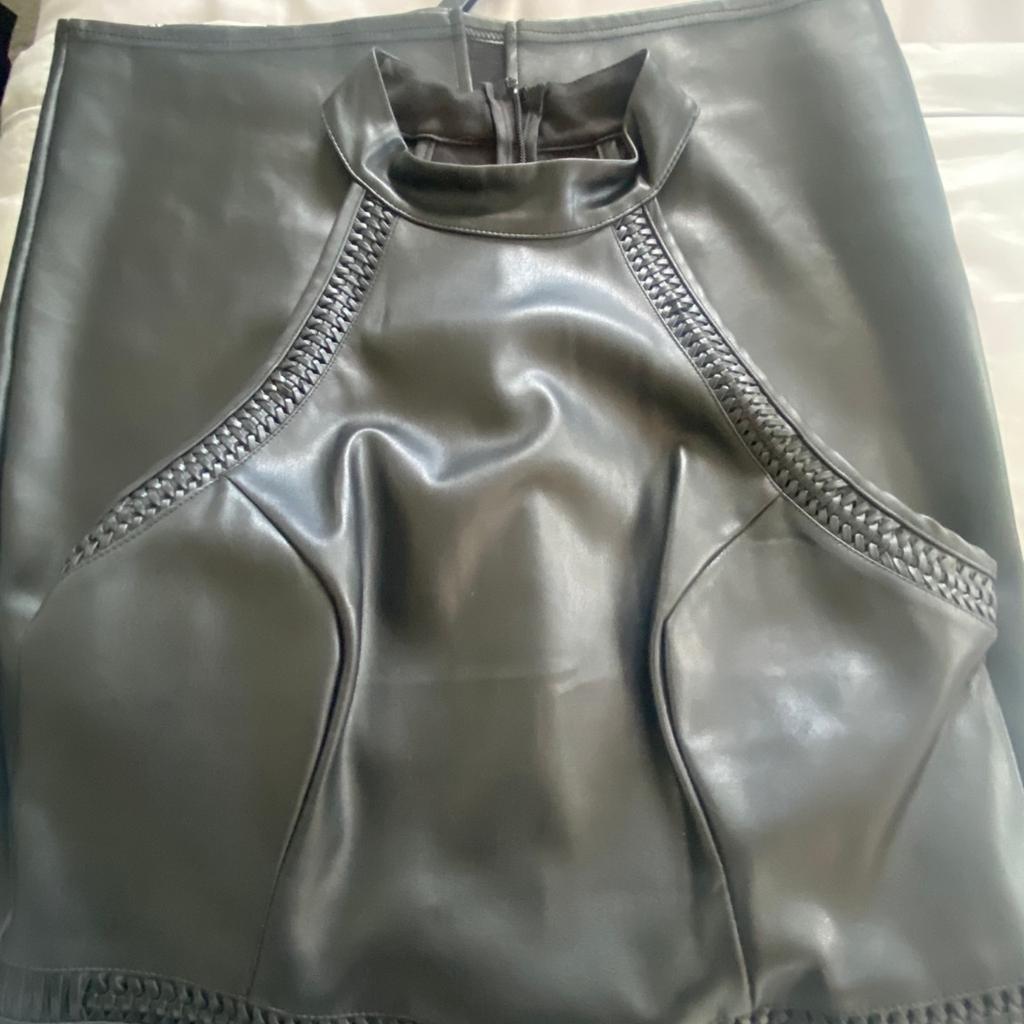 Like brand new. Worn twice which was a big hit. UK size 12 black pleather material, great for a Xmas party.