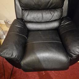 Black faux leather recliner armchair.It has some marks but the mechanism still working good.