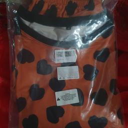 Orange Black Heart Ladies Pyjama set

Colour: Orange

Size: Medium 

Long Sleeve

Material: 89% Polyester,  11% Spandex

Delivery or Collection from Stratford, East London

Cash or Bank Transfer accepted