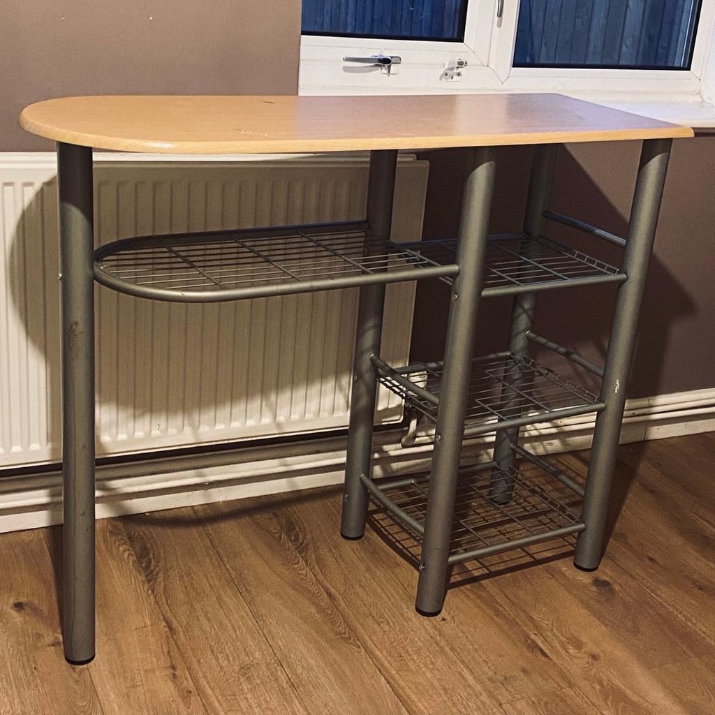 It’s an ironing board, can put a cloth on top, also space at the bottom for iron, laundry and extra bits. Willing to drop off within Bolton only for £10