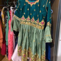 Girls anarkhali type of round dress with trousers 
Age I would say 4-5 years