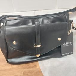 STILL WITH ORIGINAL PACKING ONLY REMOVED TO TAKE PICS..PLENTY OF COMPARTMENTS..HAS ZIP COMPARTMENT ON BACK OF BAG AS WELL.. GREAT AS PRESENT MAYBE..TOTAL BARGAIN STILL SELLING AT £26.99..NOT NEEDED SO BARGAIN FOR SOMEONE..