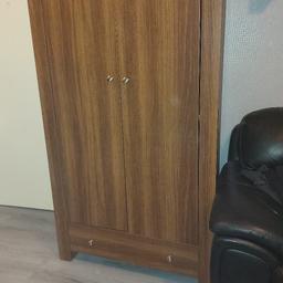 walnut colour wardrobe,with drawer. in good condition, apart from see the last picture. it doesn't effect the wardrobe as it's part of the extra piece that makes the wardrobe look wider , 71" high x 21" deep x 40" wide collection only blackburn