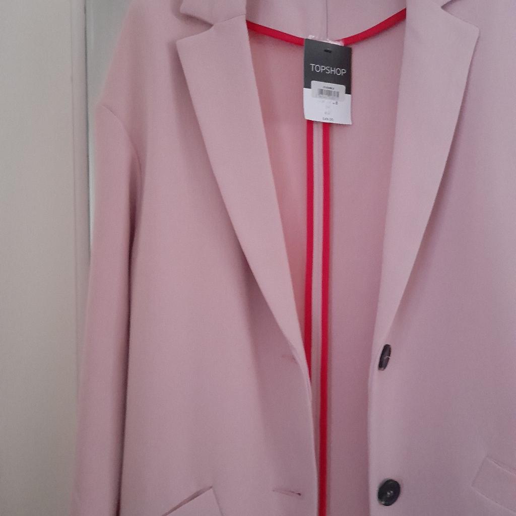 Heavy quality pink trench coat with interesting detailing. Pet and smoke-free home. Collection only.