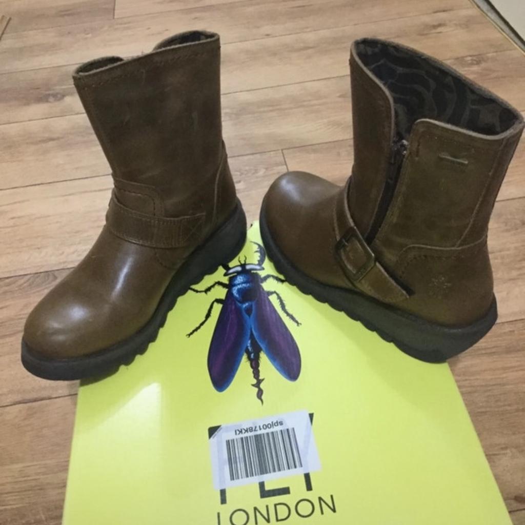 New still in box size 2.5 camel colour, fly London boot, lovely boot.