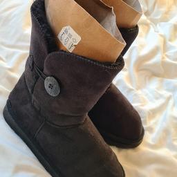Black Australia style anle snow boots with buttons in excellent condition 1st 2c will buy. Uk 5.5 but a generous uk5.5. I can offer free local delivery within five miles of my postcode or cash on collection as well as postage with extra cost. See photos for condition size flaws materials colour etc. Any questions please ask and I will answer asap. I aim to despatch same day where possible.
